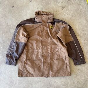 NEVER WORN - Zip Up UPS Rain Jacket with reflective details throughout